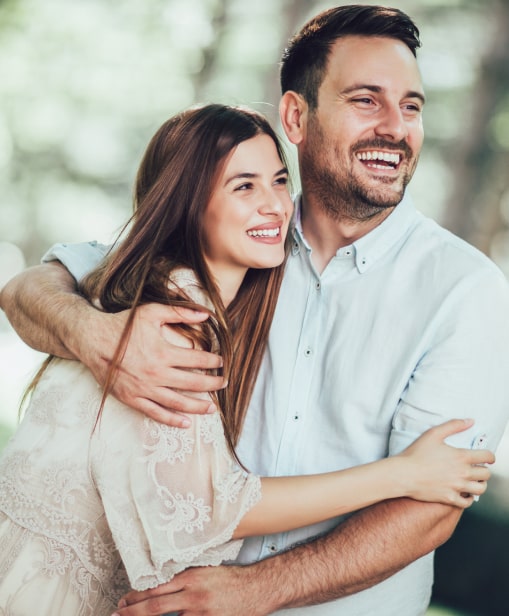 A young couple hugging each other