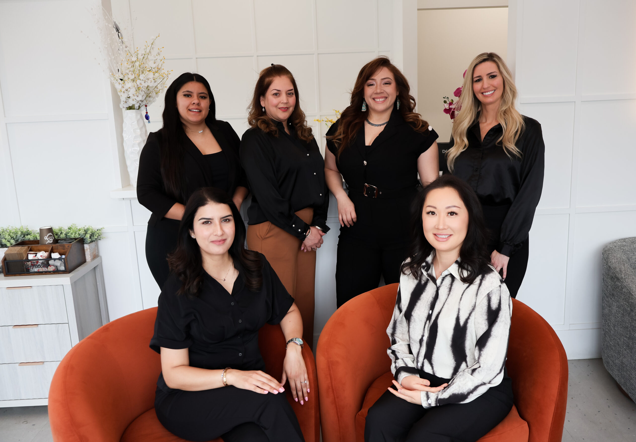 Dr. Artinian and a smiling dental assistant stand together in a bright, modern dental office in Las Vegas, NV, ready to provide quality care and a welcoming experience.