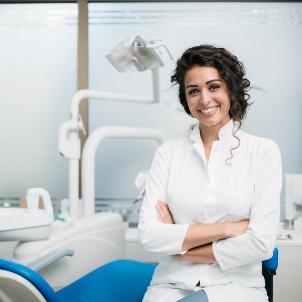 A dentist in her office