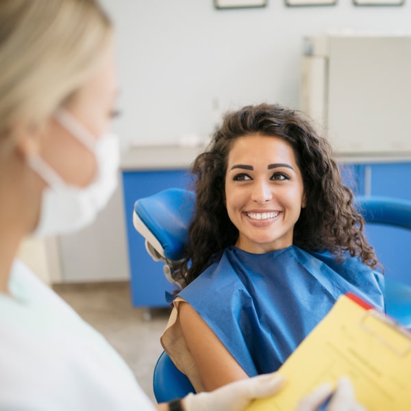 The patient and the doctor smile at each other