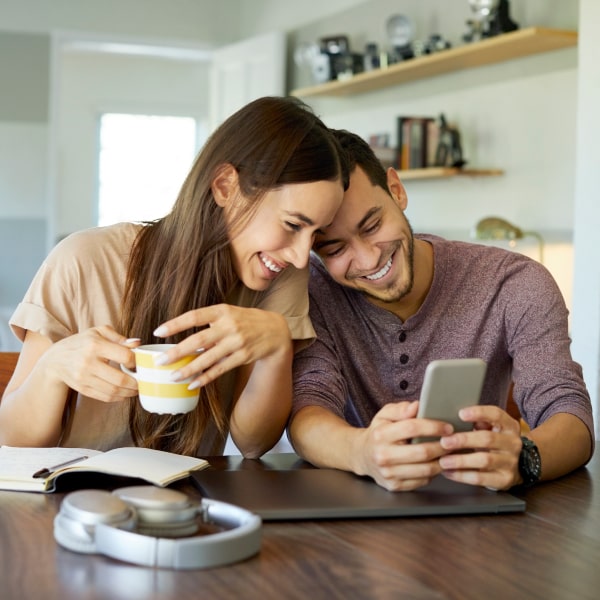 Young couple smiling at each other